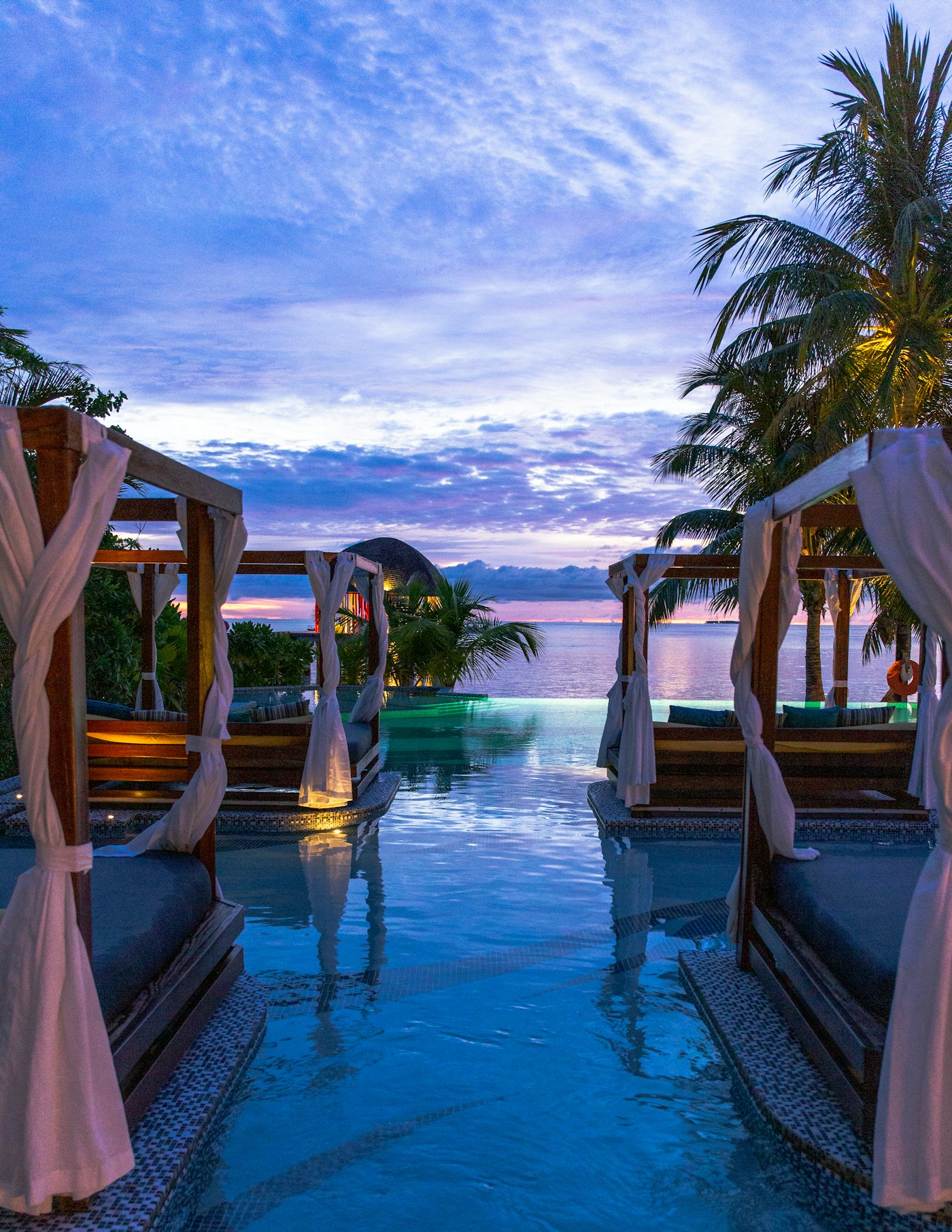 Resort swimming pool beside lounge seating